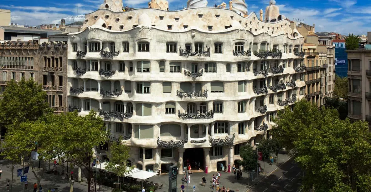 Rooftop chimney sculptures and undulating stone façade of La Pedrera, one of the standout museums in Barcelona, Spain