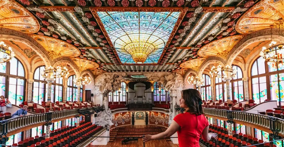 Stained-glass dome and mosaic columns inside a Modernista concert hall, one of the museums in Barcelona, Spain