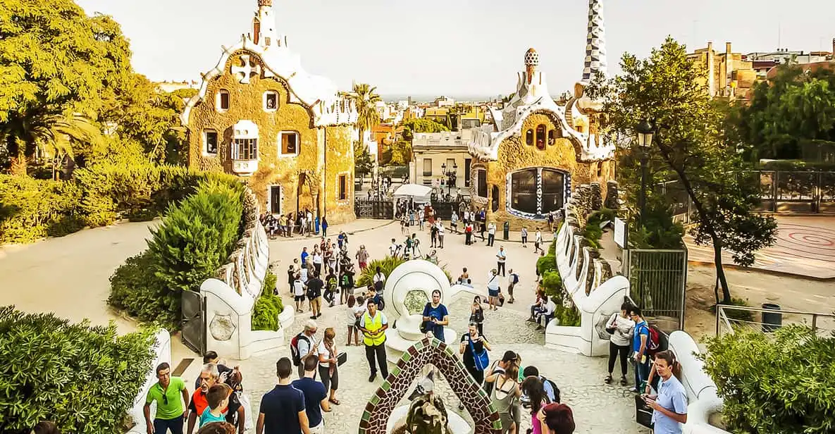 Trencadís mosaic bench and dragon fountain at Park Güell, one of the most visited museums in Barcelona, Spain