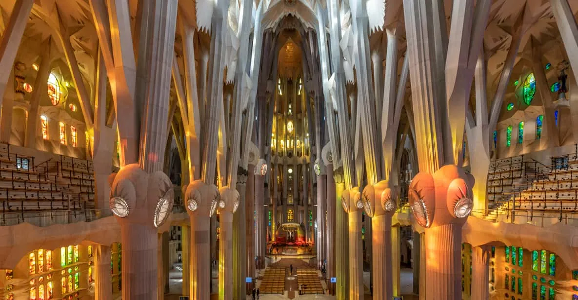 Stained-glass light filling the nave of the Sagrada Família, one of the essential museums in Barcelona, Spain